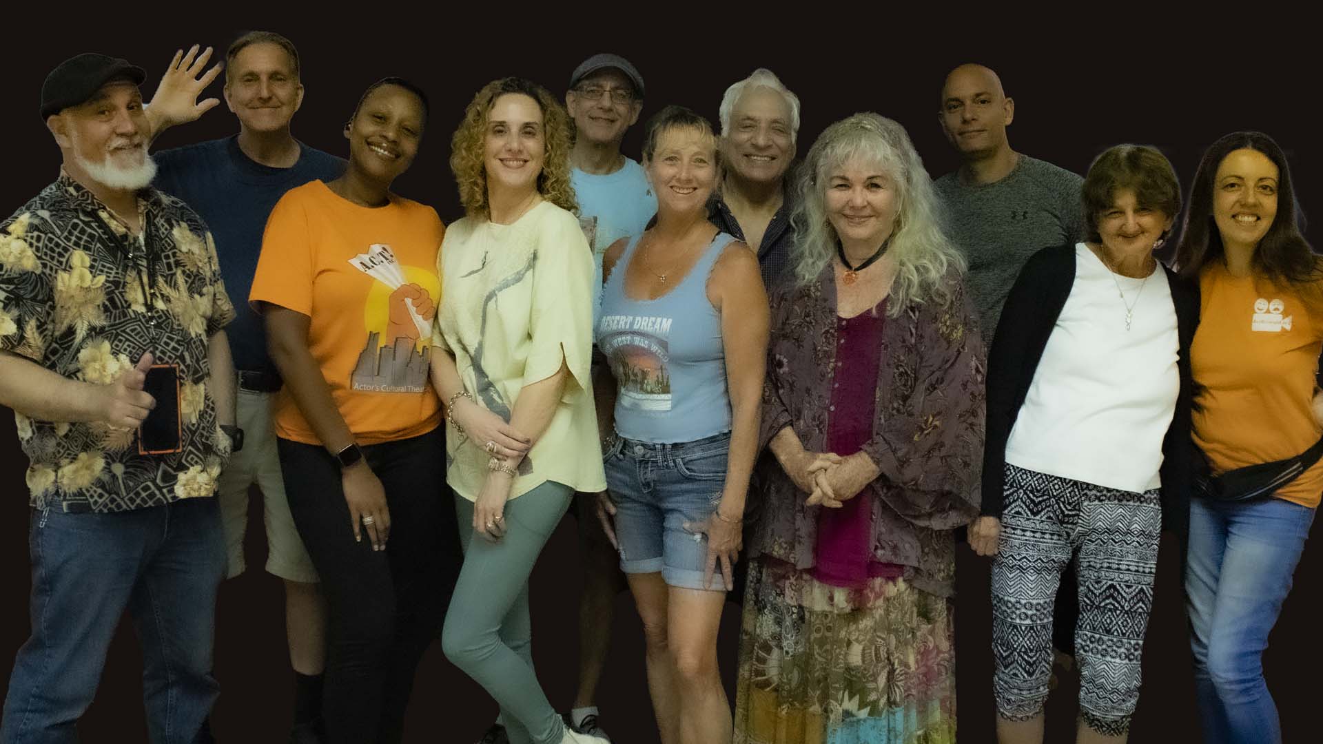 Group of actors smiling.