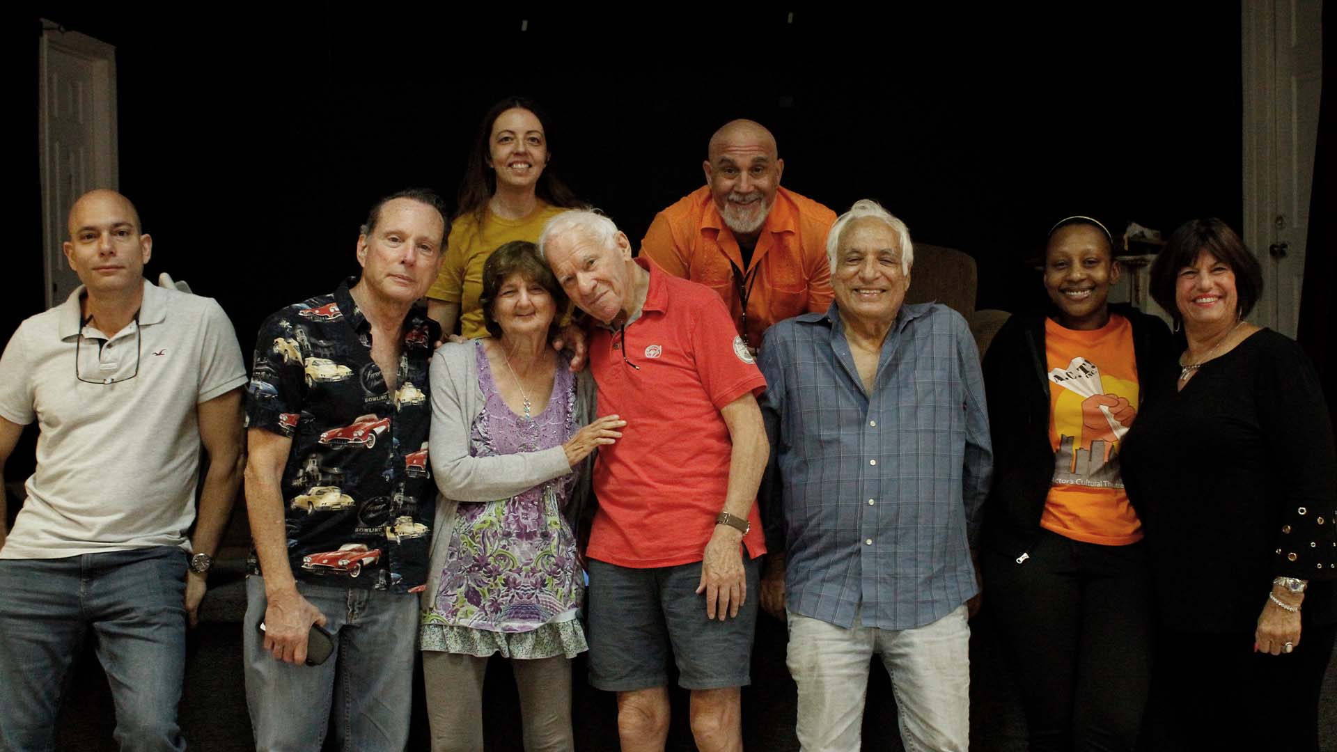 Group of actors smiling.