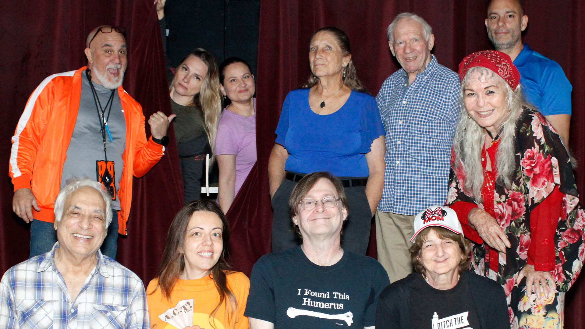 Group of actors smiling.